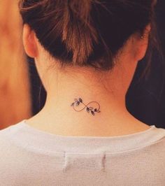 a woman with a tattoo on her neck