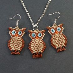 two owl shaped beaded earrings on a chain