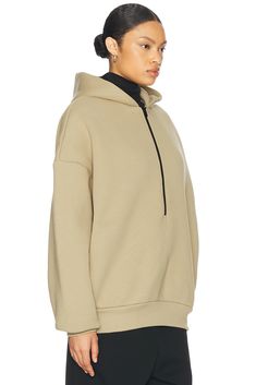 Self: 69% cotton 31% polyester, Pocket Lining: 100% cotton.  Made in Portugal.  Machine wash.  Partial front zipper closure.  Attached hood.  Side seam pockets.  Attached hood.  Fleece lining.  .  .  .  .  .  .  .  . Sporty Beige Hoodie With Kangaroo Pocket, Beige Hooded Athleisure Hoodie, Half-zip Hoodie With Zipper Closure, Half-zip Hoodie With Zipper Closure In Athleisure Style, Athleisure Half-zip Hoodie With Zipper Closure, Outdoor Half-zip Hoodie With Zipper Closure, Half-zip Hoodie With Drawstring For Outdoor, Outdoor Half-zip Hoodie With Drawstring, Half-zip Hooded Jacket With Adjustable Hood For Fall