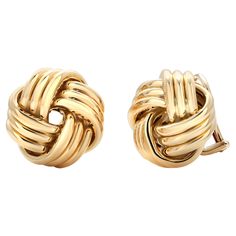 Introducing the timeless elegance of Tiffany and Co Vintage 18 Yellow Gold Knot Clip-On Earrings, a true symbol of sophistication and style. Crafted with exquisite attention to detail, these earrings exude a classic charm that transcends trends and remains a cherished addition to any jewelry collection. Marked Tiffany & Co Germany 18Kt 750 These earrings are crafted from 18k yellow gold, known for its luxurious gleam and durability. The high-quality gold ensures that these earrings will stand th Tiffany And Co Gold Earrings, Tiffany & Co, Tiffany Knot, Tiffany And Co Earrings, Large Gold Earrings, Tiffany Blue Box, Tiffany And Co Jewelry, Vintage Rhinestone Earrings, Vintage Gold Earrings