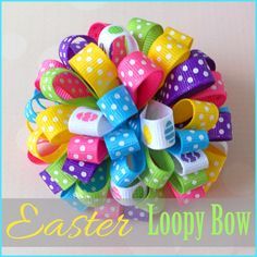 a colorful hair bow with polka dots and bows on it's center is the words easter loopy bow