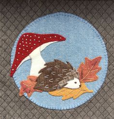 a patch with a hedge on it and a red mushroom on the back of it