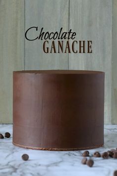 a chocolate cake with the words chocolate ganache on top