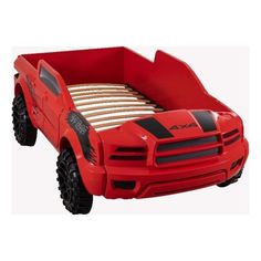 a red toy truck bed with black wheels