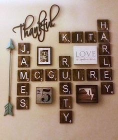 the word family spelled with wooden blocks and magnets is displayed in front of a wall