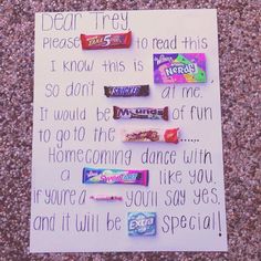 a note written to someone on the ground with candy bars in front of them,