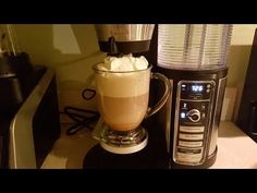 there is a coffee maker with whipped cream in it