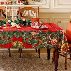 a dining room table covered in christmas decorations