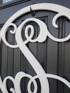 the door is painted black and white with an ornate letter s on it's side