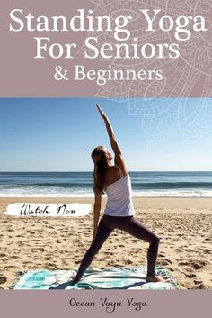 a woman doing yoga on the beach with her arms in the air and hands up