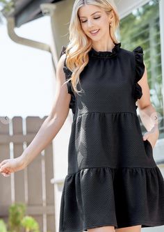 textured baby doll tiered dress featuring ruffled neck, key hole back, ruffled armhole and hidden pockets. 95%polyester, 5%spandex Dress Layer, Ruffle Sleeve Dress, Top Graphic Tees, Key Hole, Tiered Dress, Pet Hair, Black Media, Baby Doll, Sleeve Dress