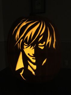 a pumpkin carved to look like an anime character