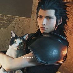 an image of a man holding a cat in front of his face and wearing armor