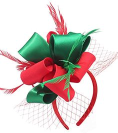 a red and green bow with feathers on it