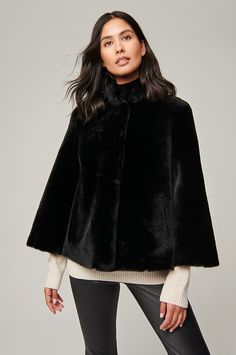 Delightfully dreamy, the Marilyn shearling cape jacket offers a stylish outerwear option for day-to-evening wear. Crafted of plush sheepskin, this layering-ready piece marries the practicality of a jacket with the playfulness and flexibility of a cape. With just enough pockets to safely hold your gloves and small essentials and a stand-up collar designed to shield you from wintery breezes, this jacket will swing and sway to your heart's content no matter where you take it. Leather Coat With Fur, Moto Jacket Style, Sheepskin Jacket, Cape Jacket, Leather Jacket Style, Lambskin Leather Jacket, Sheepskin Coat, Black Leather Gloves, Leather Trench Coat