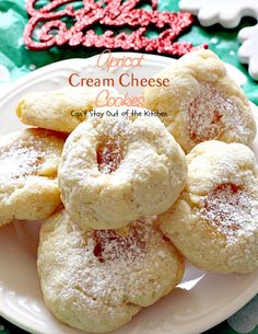 some sugary cookies on a white plate with red and green napkins in the background