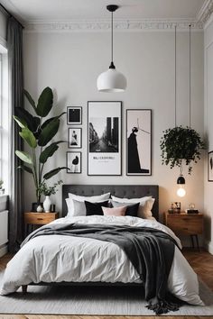 a bedroom with white walls and pictures on the wall