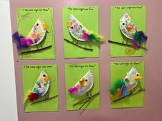 four pictures of birds made out of paper and colored feathers on green cards with words