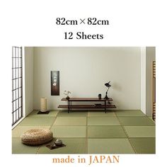 the room is made in japan and has green tiles on the floor with white walls