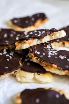 chocolate covered cookies with white sprinkles on top