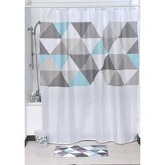 a bathroom with a shower curtain and rug