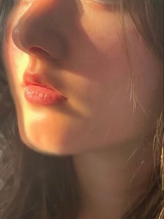 a close up of a woman's face with long hair