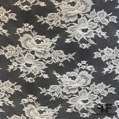 white lace with flowers on black background