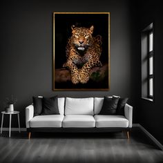 a living room with black walls and a white couch in front of a leopard painting on the wall