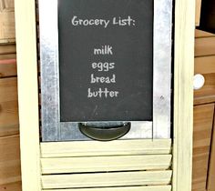 a sign that says grocery list milk eggs bread butter