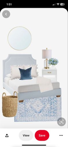 a bedroom with blue and white decor on the walls, an oval mirror above the bed