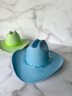 "The Sky Blue cowboy hat is a bold sky blue painted hat with blue or clear acrylic chain detail. Wear this hat for your bestie's bachelorette weekend, birthday party, to rep your team, or just for fun! Clear or blue clear chain available. Message me about custom designs and colors! Order 2 or more items and receive free ground shipping!! Discount reflected in checkout. **I have a new style of cowboy hat AND new paint colors that vary slightly from hats I released in 2021** - The hat you will rec Cowboy Hat Bachelorette, Blue Cowboy Hat, Bachelorette Cowgirl, White Cowboy Hat, New Paint Colors, Cowgirl Hat, Cowgirl Hats, Bachelorette Weekend, Cowboy Hat