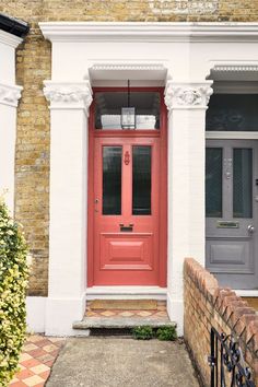 a red front door on a brick building