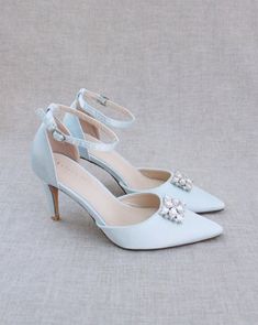 This classic satin pointy toe heels adorned with a sparkly square brooch making this a great statement piece for bridesmaids shoes, prom shoes and all your special occasions. The light blue color can easily be your something blue. Perfect mix of traditional elegance with a touch of dazzle. DETAILS: HEELS: 3 inches UPPER: Synthetic upper and lining MATERIALS: Manmade outsole ORIGIN: Imported Brooch Making, Bridesmaids Shoes, Red Hunter, Shoes Prom, Flower Girl Shoes, Blue Wedding Shoes, Bridal Flats, Pointy Toe Heels, Satin Shoes