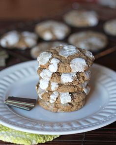 a stack of cookies sitting on top of a white plate