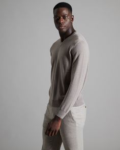 DESCRIPTIONThis V-neck men's sweater is crafted from plain knitted Kid Cashmere, an extremely fine and soft fibre, obtained exclusively from the undercoat of the Hircus goat kids. The sweater features a neckline trim with an original zigzag pattern. Its precious and exclusive yarn makes this garment the luxury version of an essential knitwear item.FABRICSThe Kid Cashmere yarn is obtained from the undercoat of Hircus goats kids. The natural molt allows to harvest this precious, exclusive and ultr Goat Kidding, Zigzag Pattern, Cashmere Yarn, Zig Zag Pattern, Men's Wardrobe, Art And Technology, V Neck Sweater, State Art, Men's Sweater