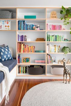 a living room filled with lots of books