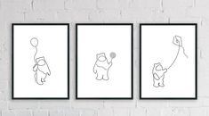 three framed art prints on a brick wall, one with a balloon and the other with a bear