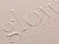 closeup of the logo for joli's fine linens in white paper