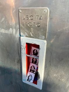 a close up of a metal object with pictures on it's side and an arrow pointing to the right