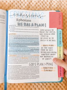 an open bible with the words ephesians and his plan written in blue on it