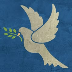 a white dove with an olive branch in it's beak flying through the air