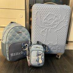 two children's backpacks, one with stitch and the other has an animal design on it