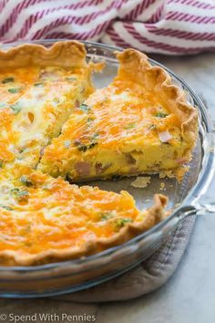 a cheesy quiche in a glass pie dish