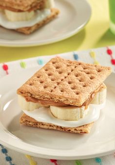 an image of a sandwich on a plate with crackers in the shape of hearts