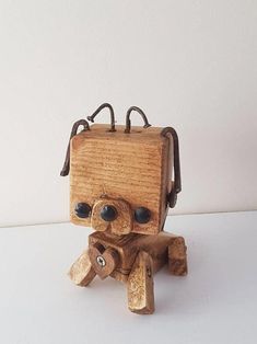 a small wooden toy sitting on top of a table