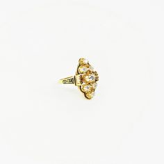 "The \"Francesca\" ring is a stunning Victorian Revival dress ring, which boasts approximately .60 ctw of sparkling brilliant cut diamonds set amongst buttery 14k gold and black enamel detailing on the top and shoulders. She has great finger coverage without going overboard, measuring at 13/16\" in height and about 1/2\" in width, and her nice ring size of 8.5 makes her accessible to many. We estimate her age to be about circa 1930's, which was the height of Victorian Revival jewelry and this pi Victorian Revival, Victorian Gold, Statement Dress, Dress Rings, Black Enamel, Brilliant Cut Diamond, Statement Rings, Gold Diamond, Ring Size