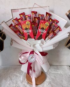 a bouquet of candy wrapped in white paper