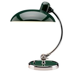 a green desk lamp with a chrome base and an arm that has a white light on it