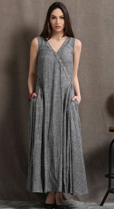 A-line Sundress Maxi Dress With Pockets, V-neck Sundress Maxi Dress With Pockets, Sleeveless Sundress Maxi Dress With Buttons, V-neck Sundress With Pockets, V-neck Sundress Midi Dress With Pockets, Elegant Sleeveless Maxi Dress With Pockets, Sleeveless Gray Maxi Dress For Spring, Spring Sleeveless Maxi Dress With Pockets, Casual Long Dress With Pockets