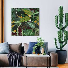 a living room filled with furniture and plants